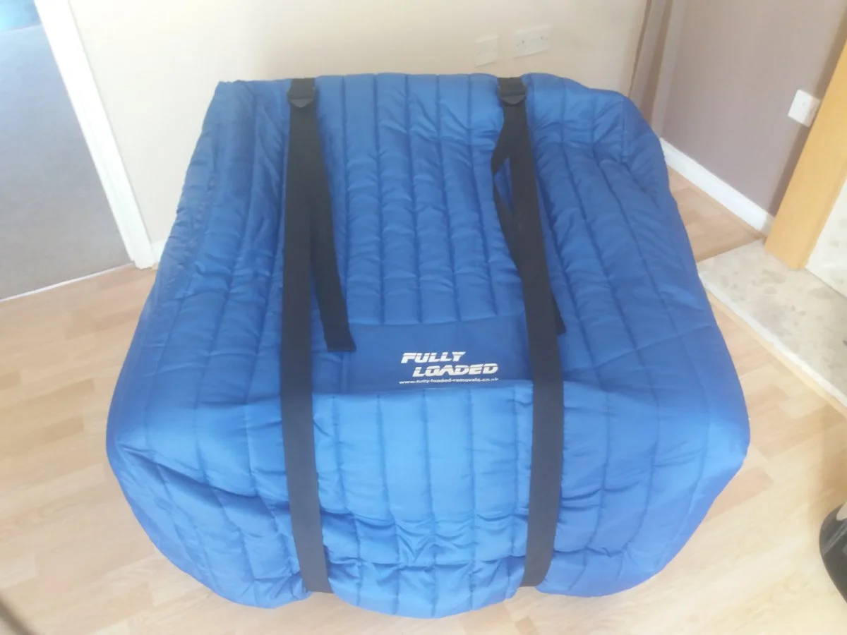 Armchair in a Fully Loaded Removals protective cover