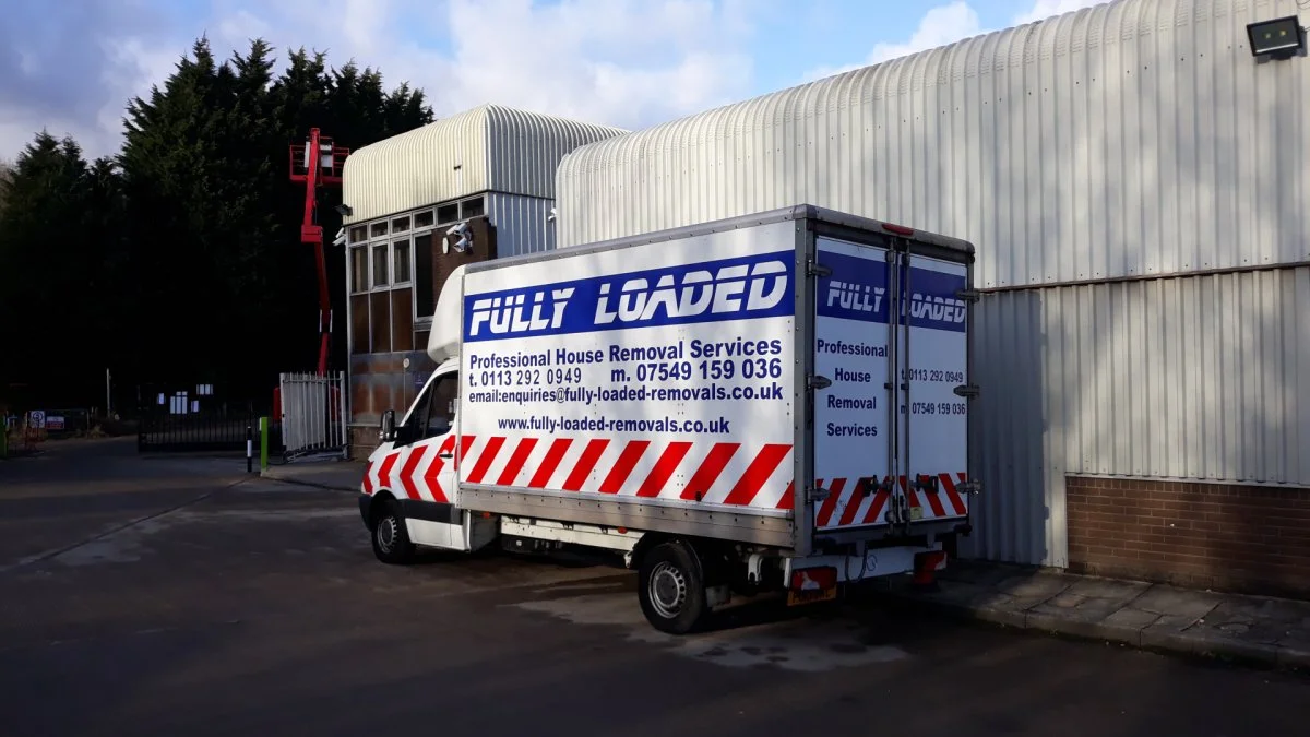 Fully Loaded Removals Luton van at a commercial unit