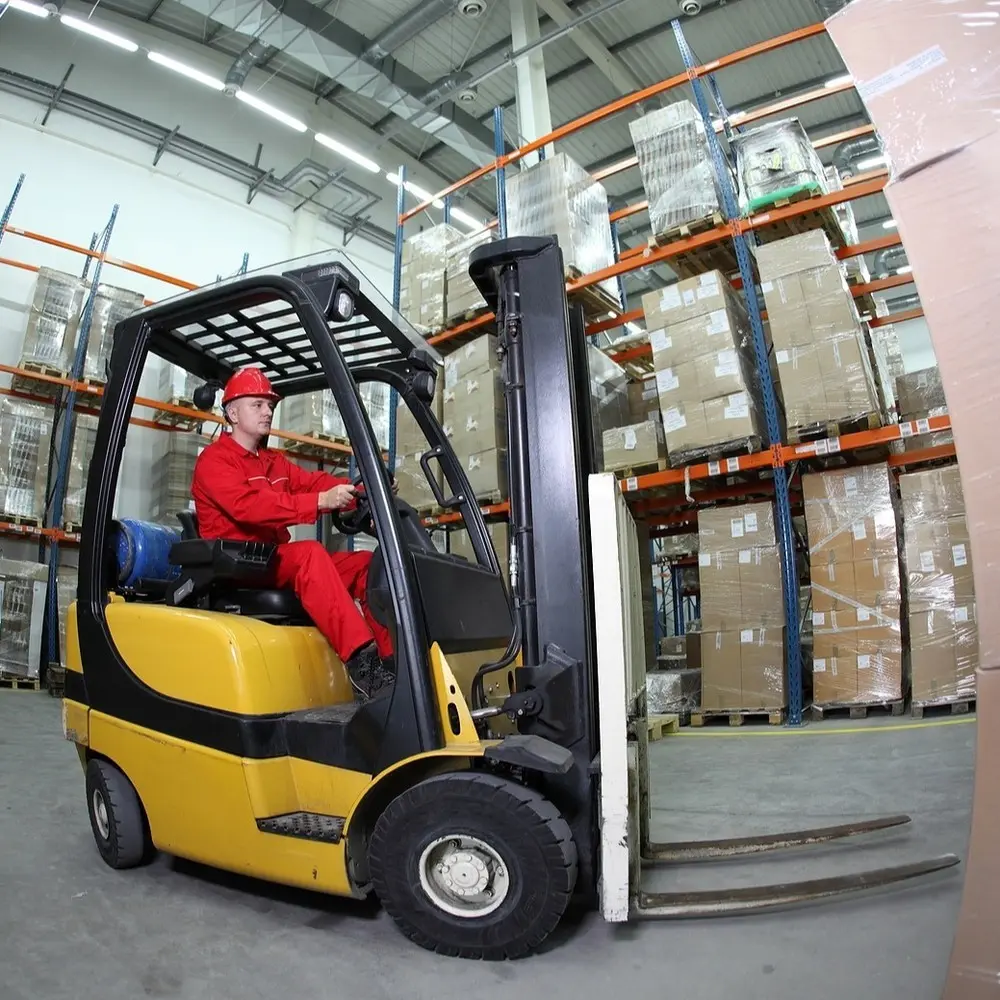 Forklift operator in a warehouse