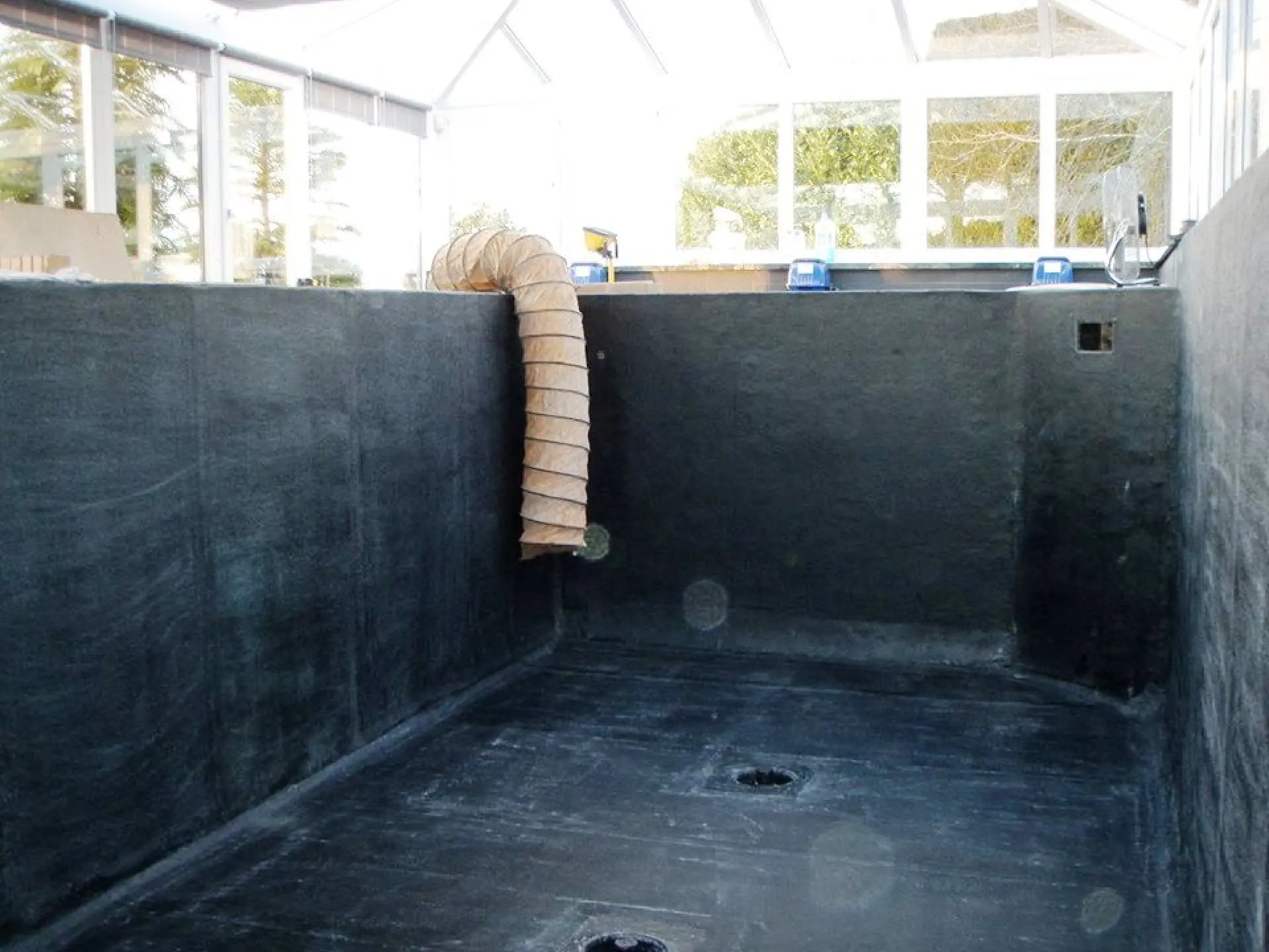 Large koi pond lining before flocoat.