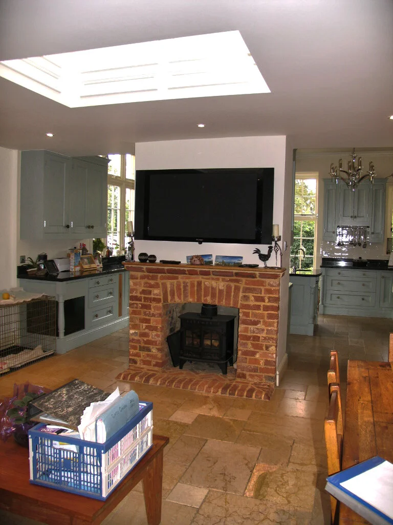 Kitchen with a brick fireplace and roof light