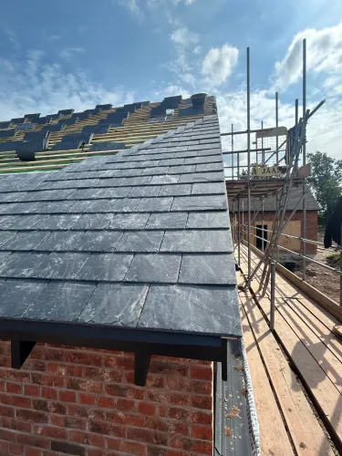 New Spanish slate roof with 7 velux (image 4 of 21)