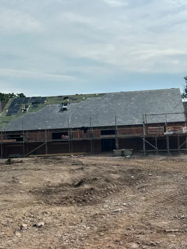 New Spanish slate roof with 7 velux (image 6 of 21)