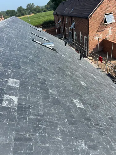 New Spanish slate roof with 7 velux (image 9 of 21)