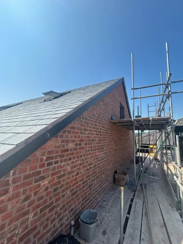 New Spanish slate roof with 7 velux (image 11 of 21)