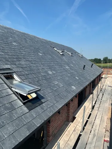New Spanish slate roof with 7 velux (image 12 of 21)
