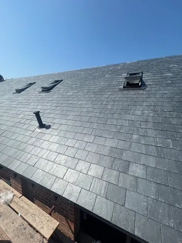 New Spanish slate roof with 7 velux (image 13 of 21)