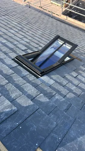 New Spanish slate roof with 7 velux (image 16 of 21)