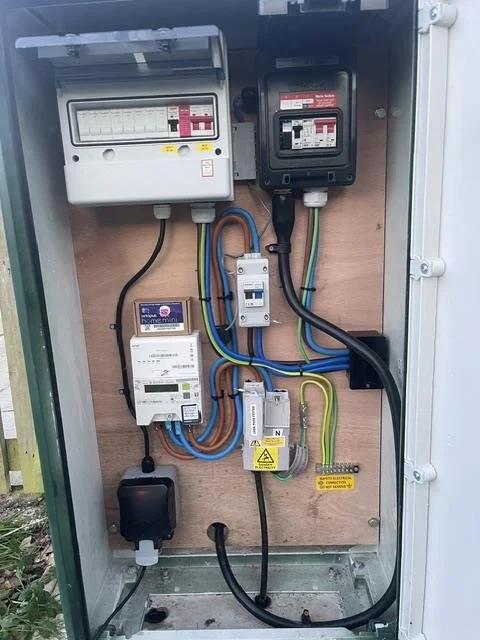 Outdoor supply cabinet with meter and distribution board