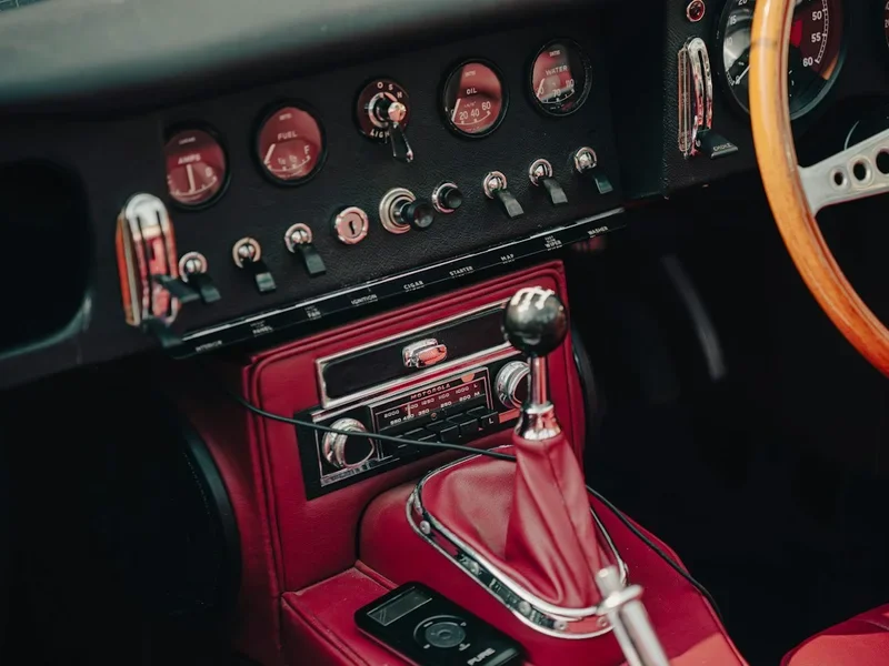 Red leather dashboard and centre console in a classic car