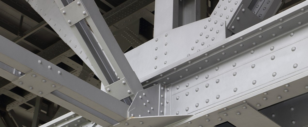 Riveted steel beams in a structure