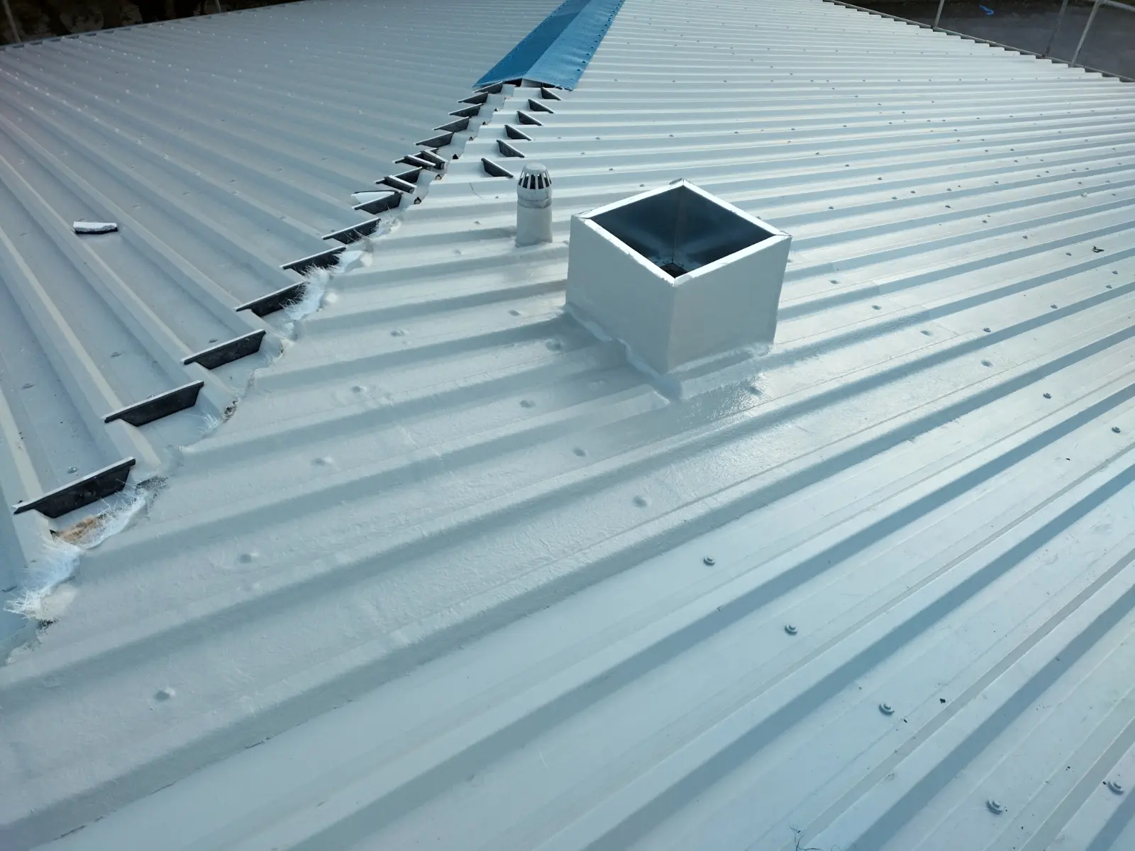 Grp weathering on corrugated metal roof.