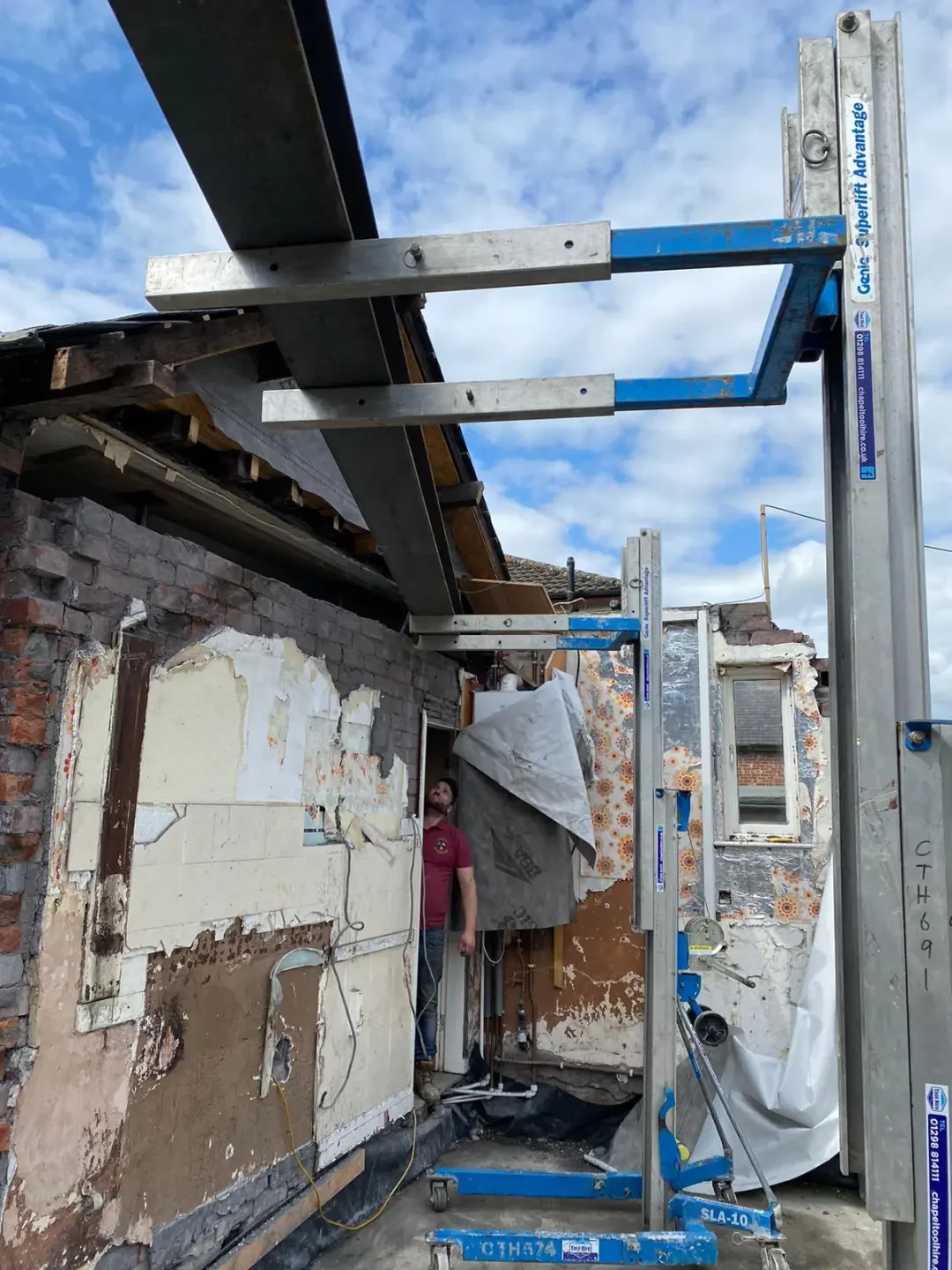 Steel beam supported above a structural opening