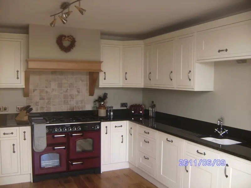 Cream shaker kitchen with range cooker