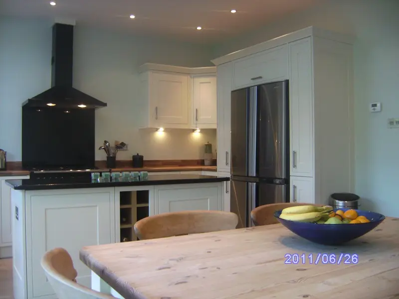 Cream fitted kitchen with range cooker