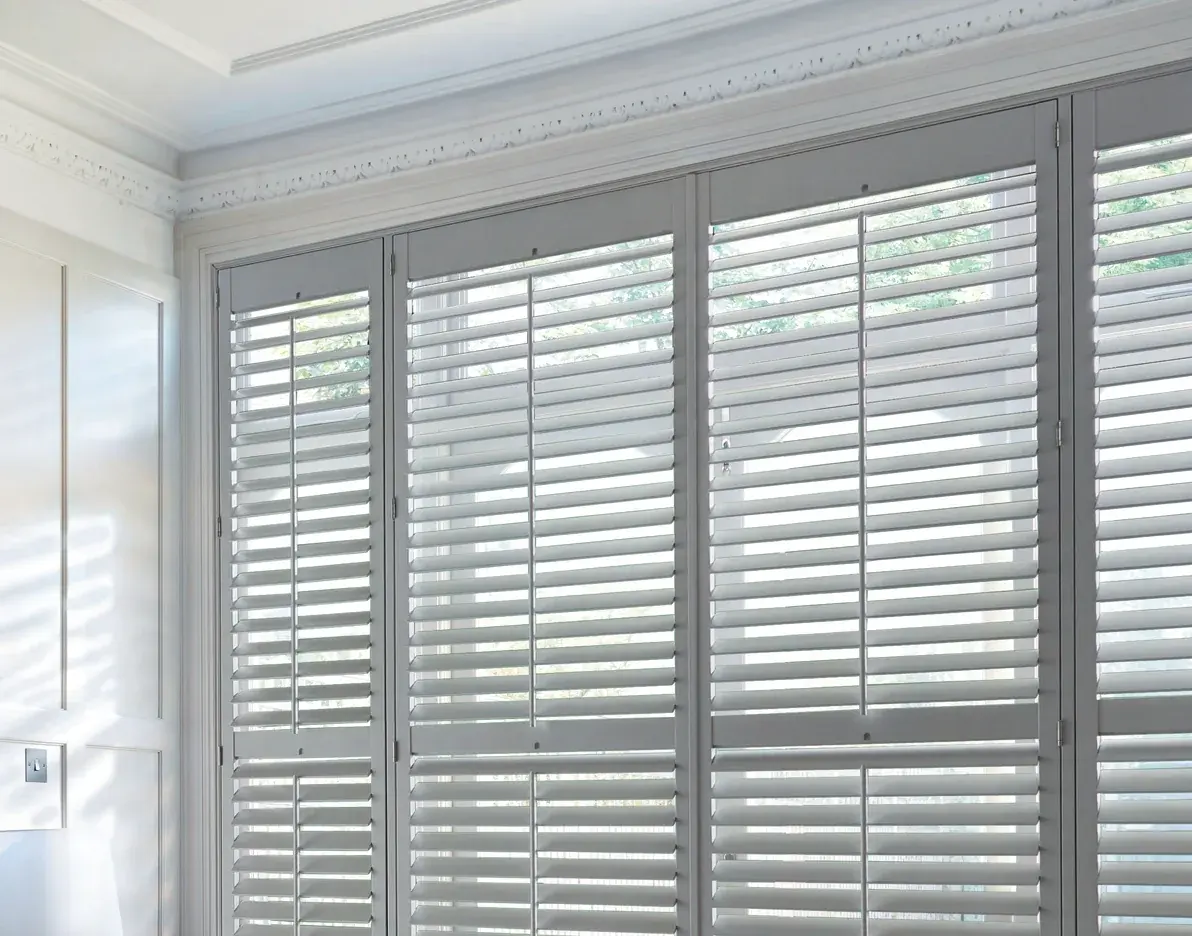 Full height plantation shutters fitted in a Chepstow living room for privacy and light control
