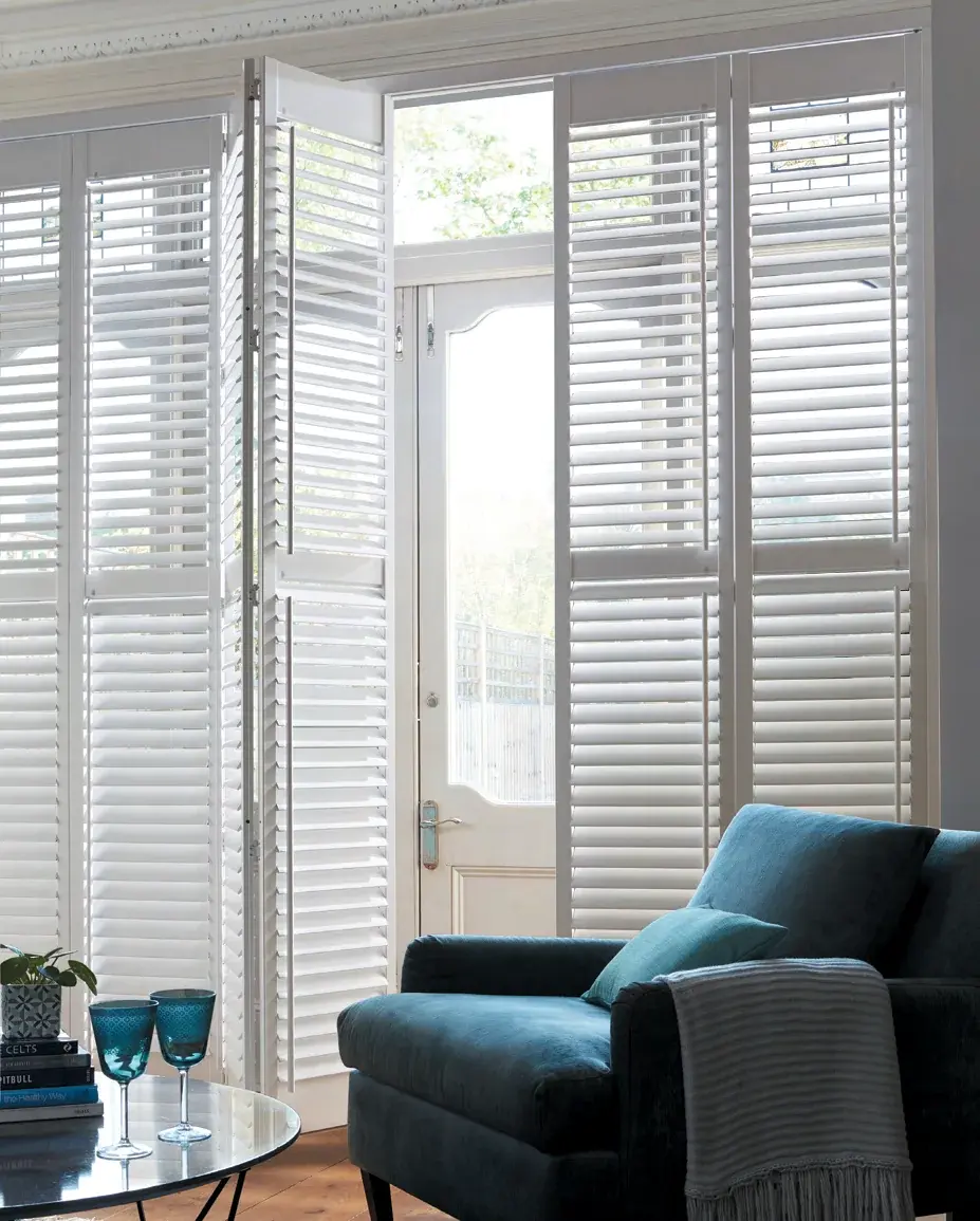 Tracked plantation shutters for a wide opening in a Bridgend home