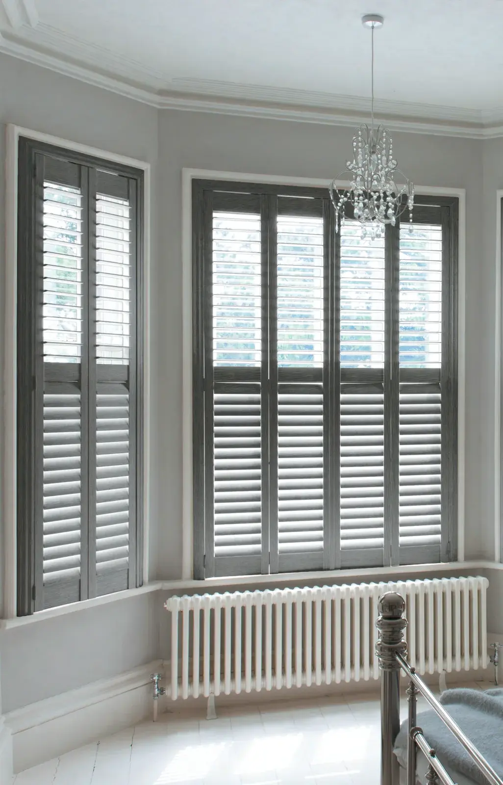 Bay window plantation shutters fitted in a Chepstow family home