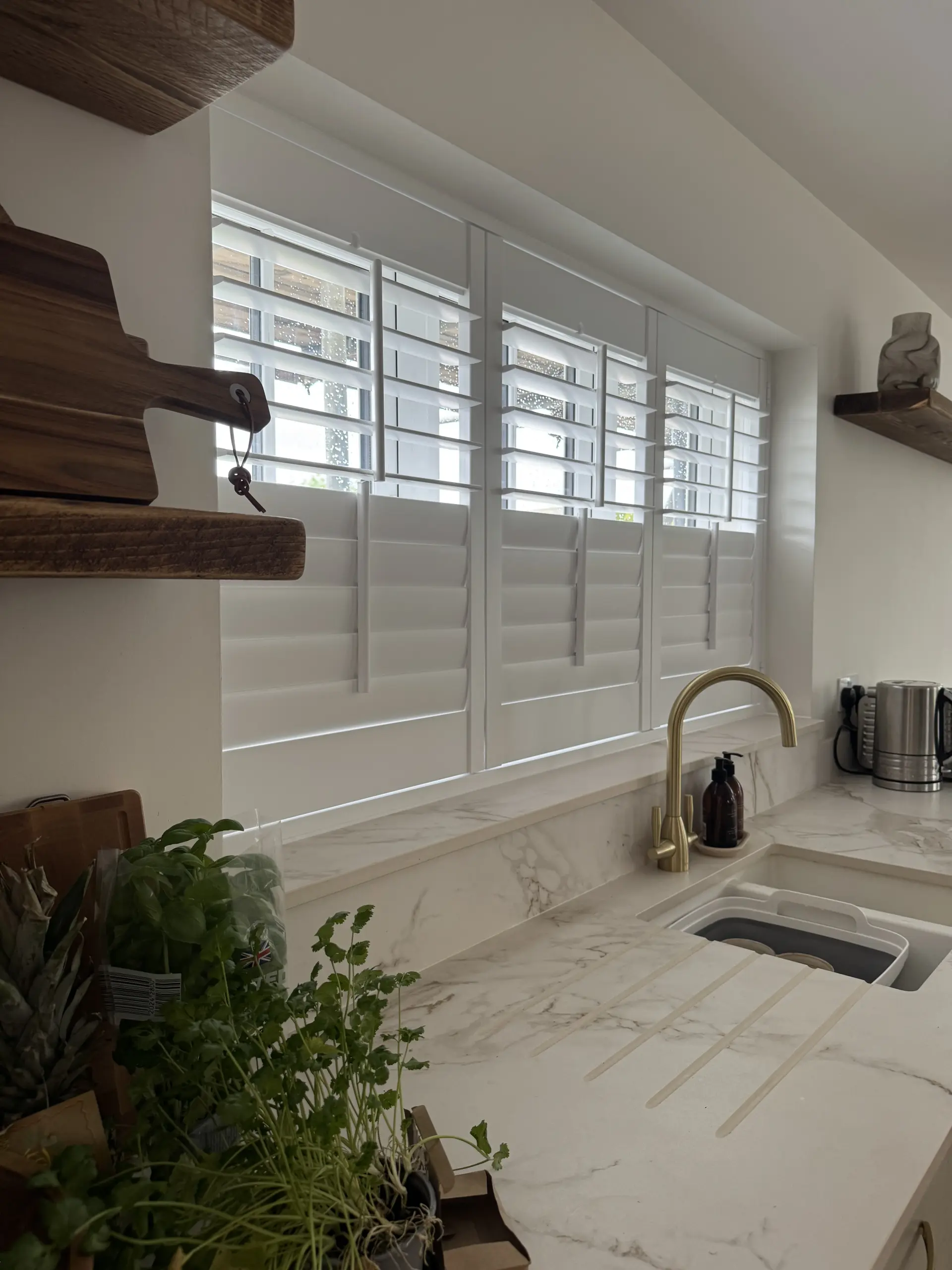 Tier on tier plantation shutters with separate panels in a Chepstow home