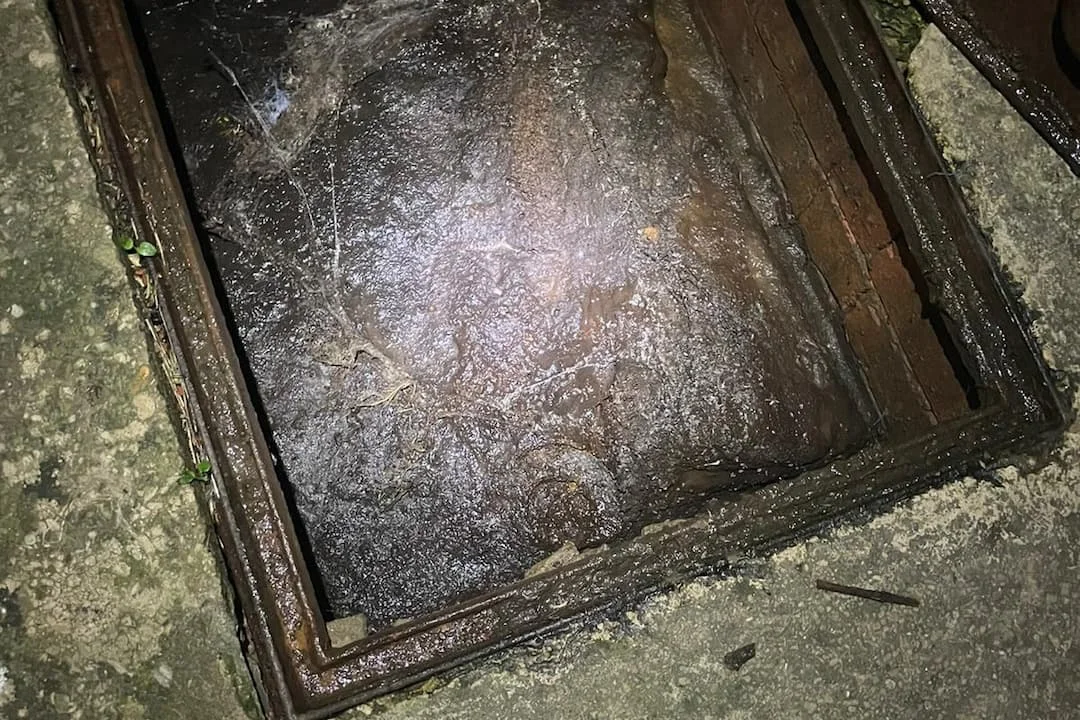 Blocked inspection chamber full of waste water