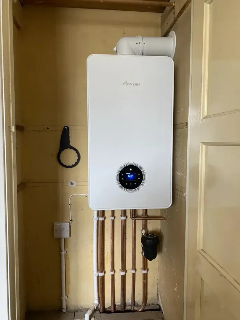 Engineer carrying out a landlord boiler safety check