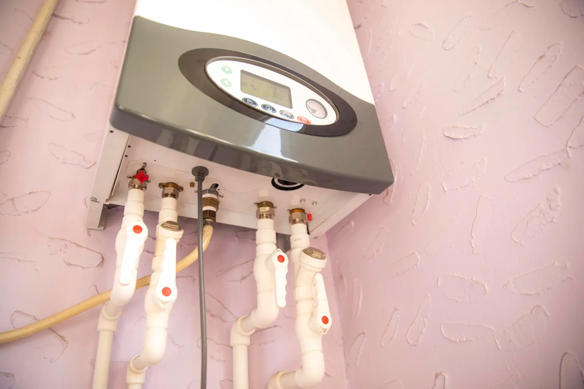Wall-mounted boiler and connected pipework