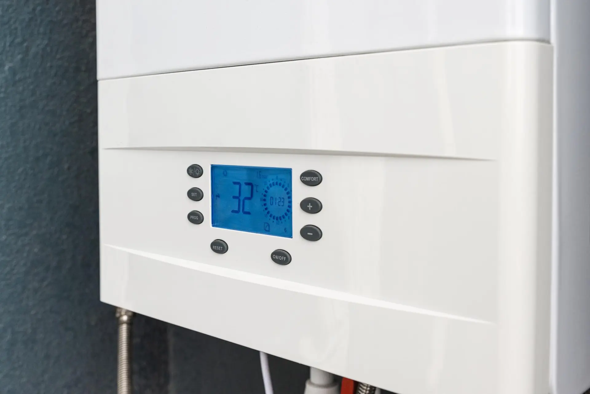 Close-up of a white boiler control panel
