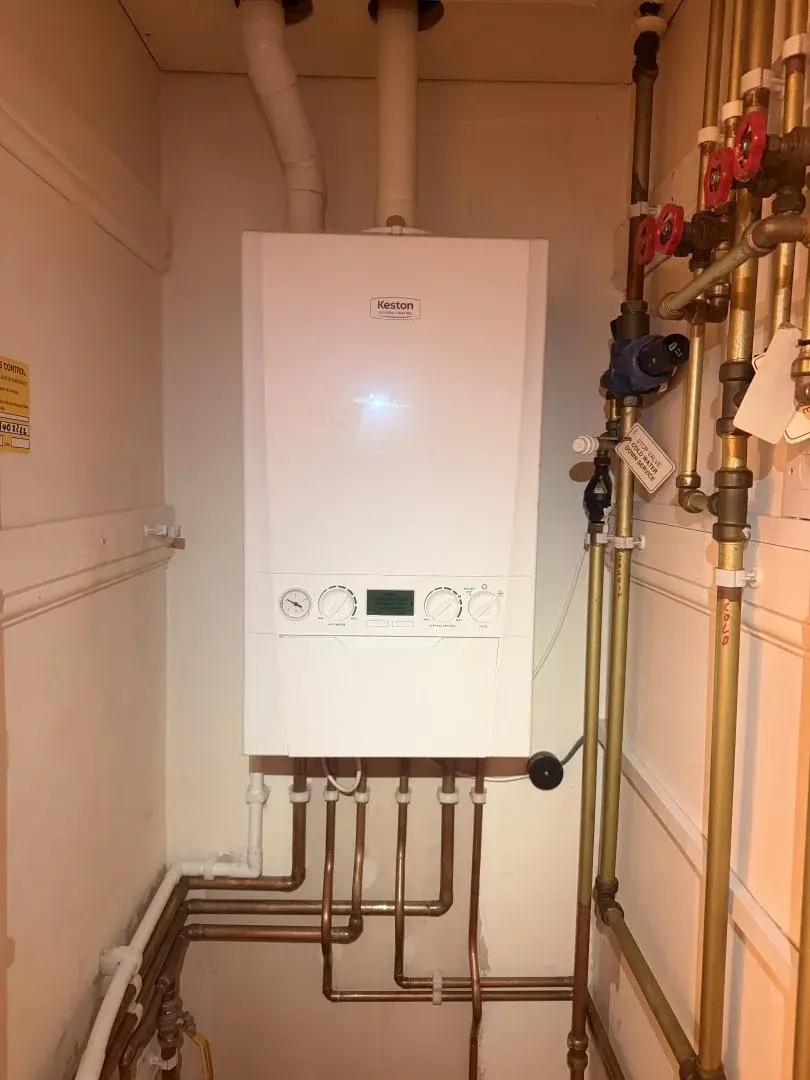 Engineer diagnosing and repairing a boiler