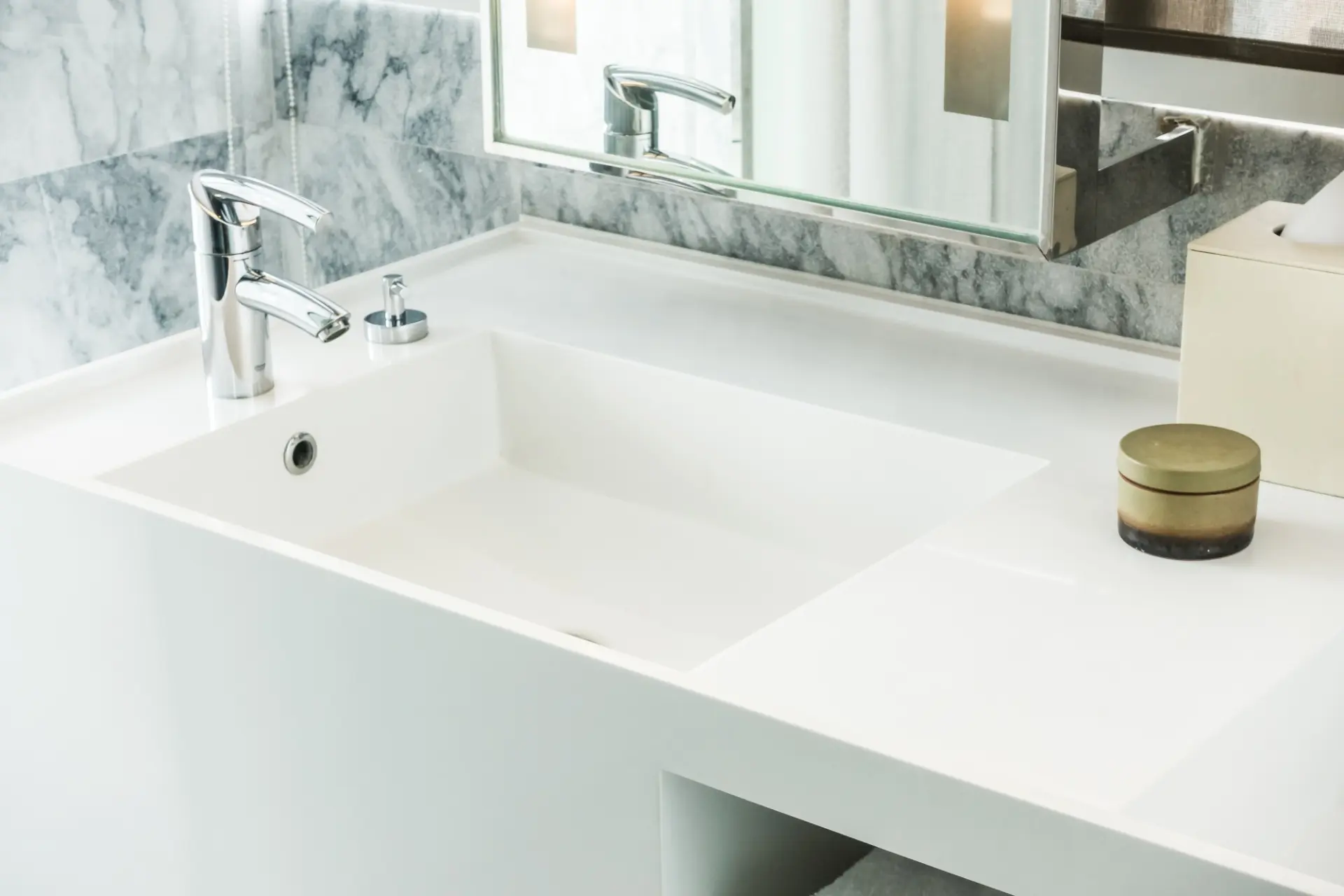 Modern white basin with polished chrome tap
