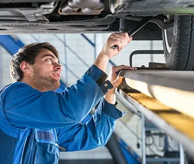 mechanic inspecting car