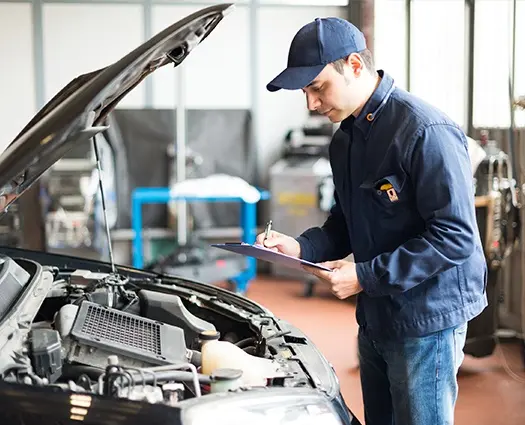 mechanic checking car MOT