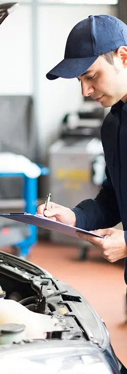 mechanic with servicing checklist