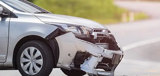 silver car damaged by accident