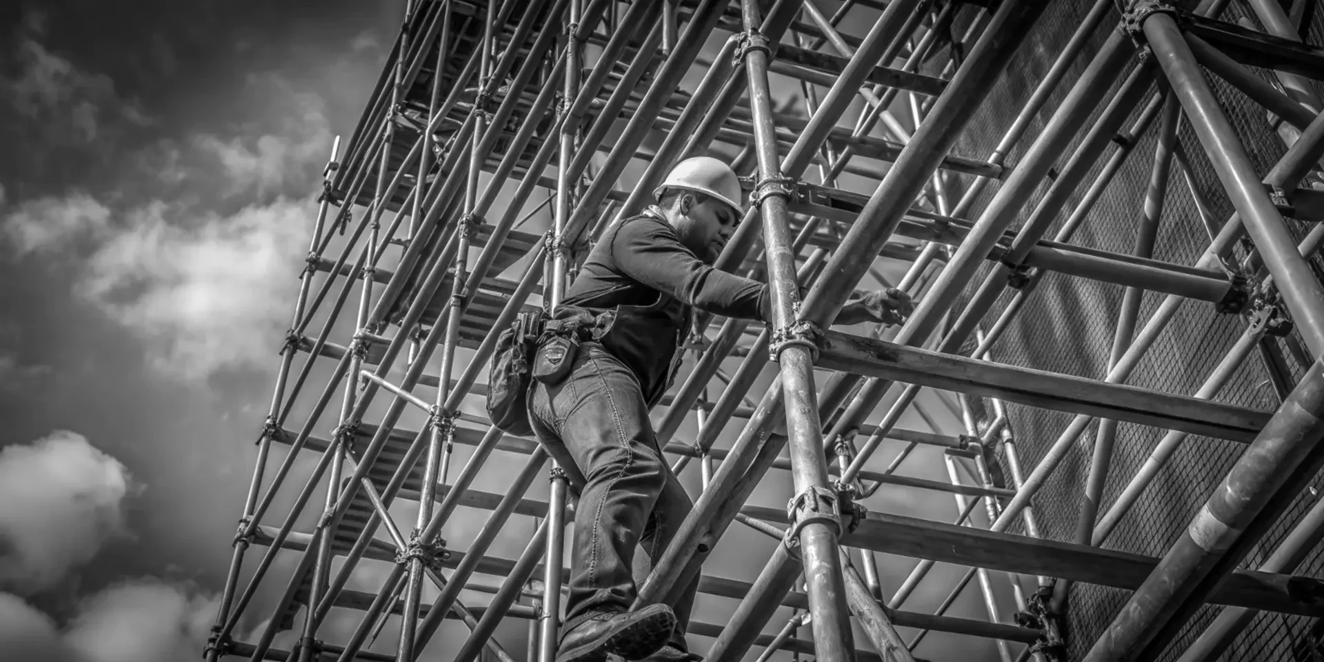 Scaffolder climbing a scaffold