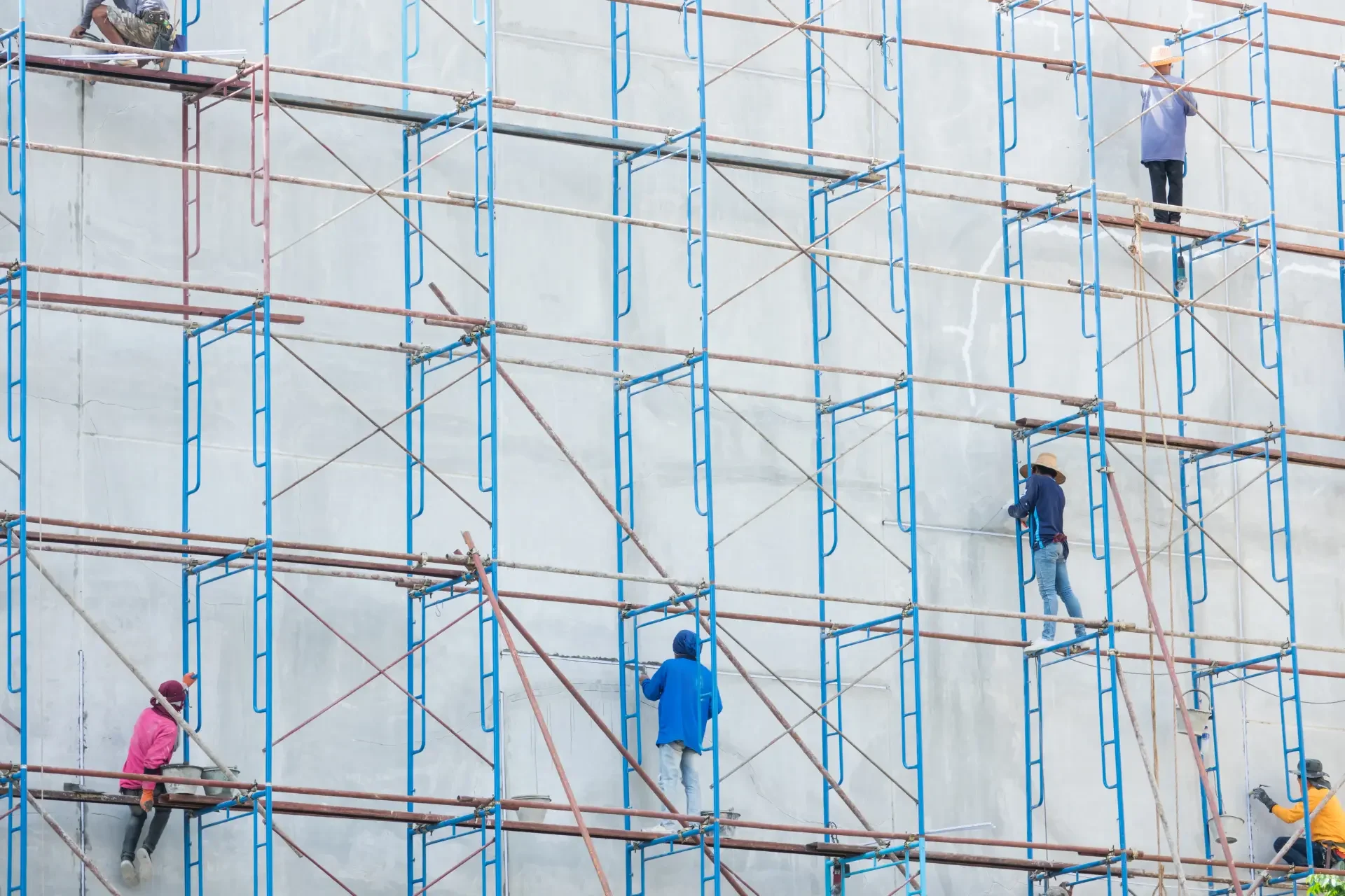 Scaffolders working on a tall scaffold