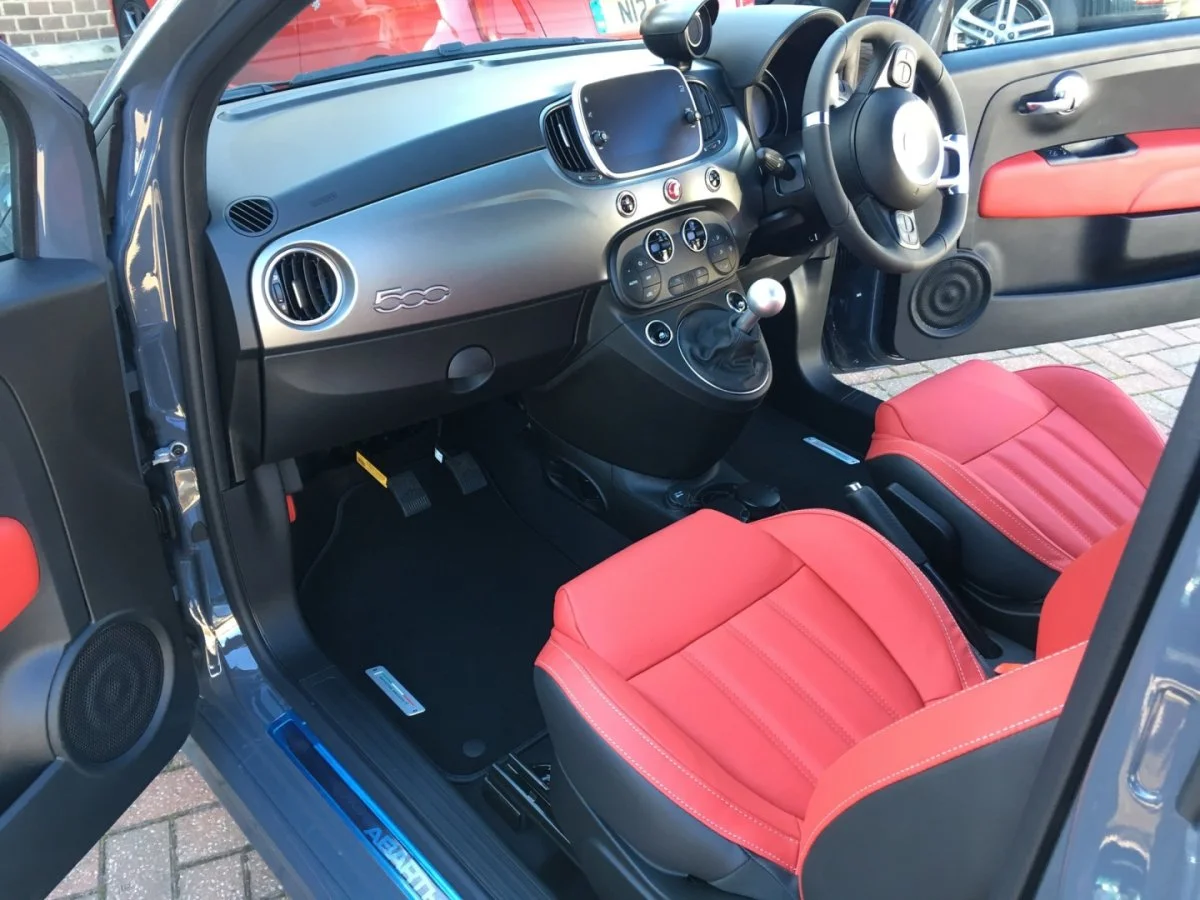 Dual controls installed in a car footwell