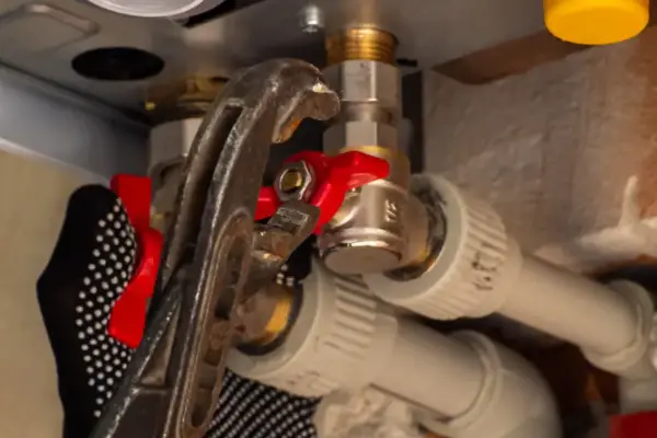 Close-up of underside boiler piping