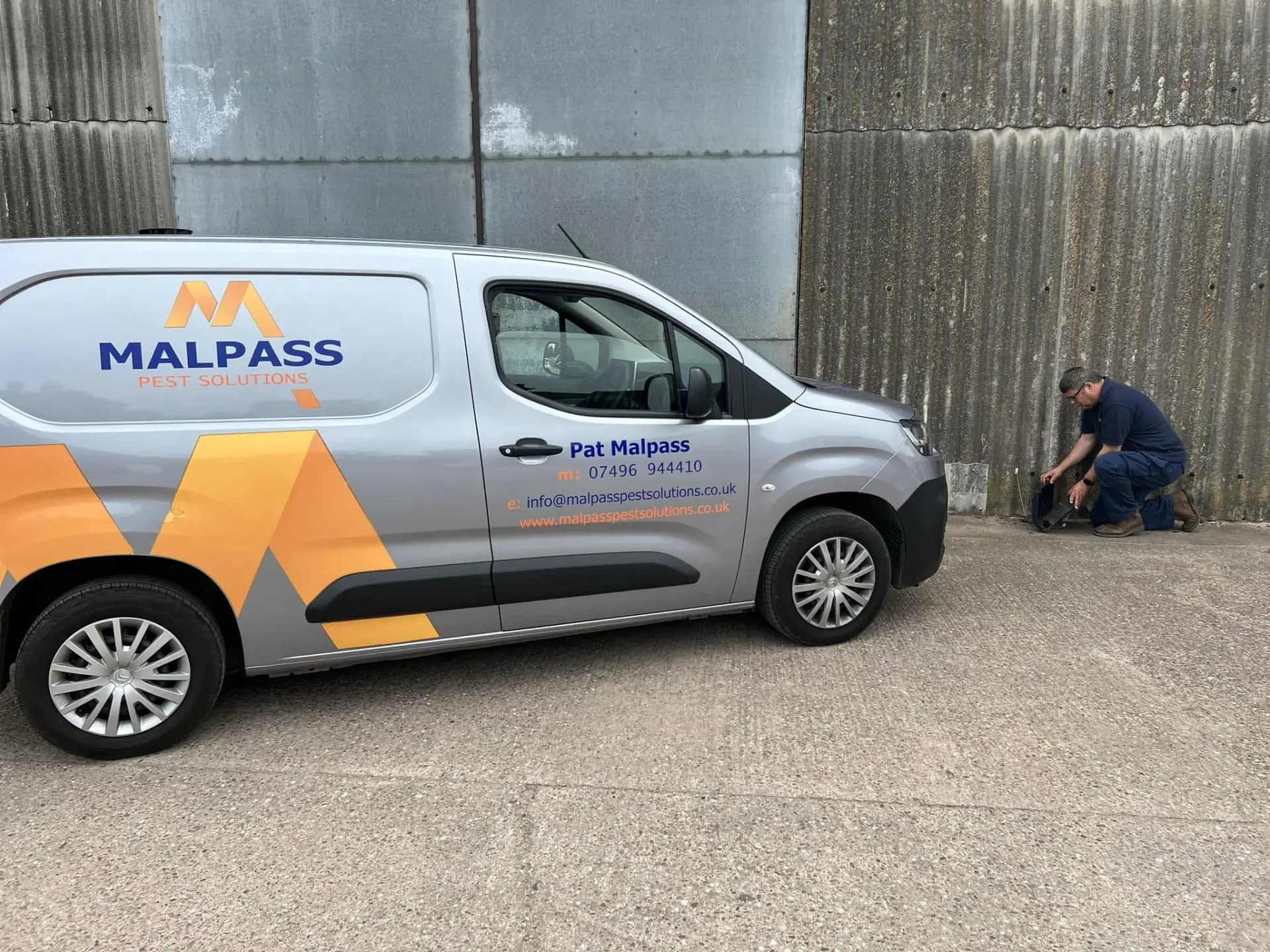 Pat Malpass attending a wasp-control visit beside the Malpass Pest Solutions van